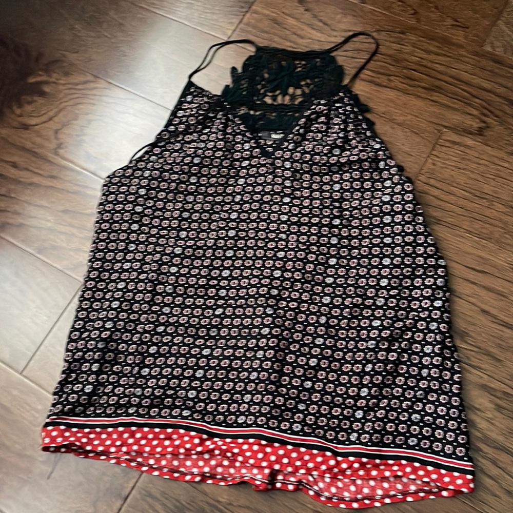 RolyPoly | women’s sleeveless blouse with floral design on upper back